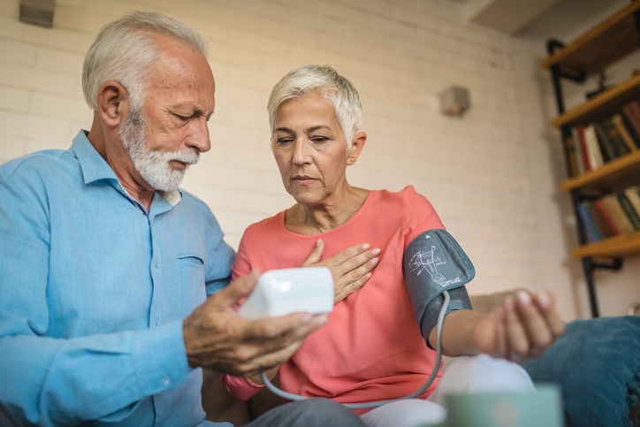Lovely senior couple measuring blood pressure- heart health-CHF